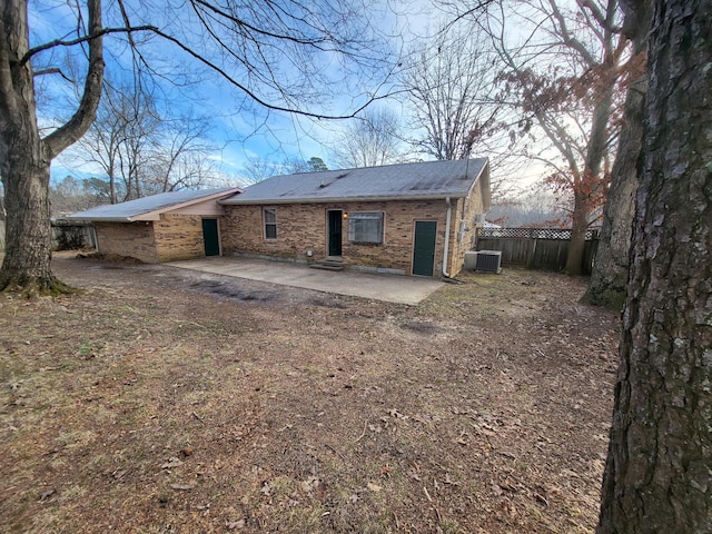 back of house featuring central AC unit and a patio