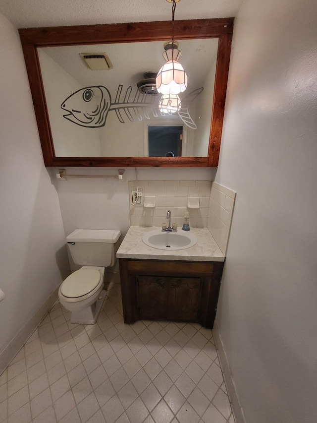 half bathroom with visible vents, decorative backsplash, tile patterned flooring, and toilet