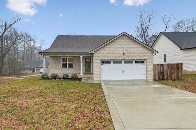 view of front of home featuring a garage and a front lawn