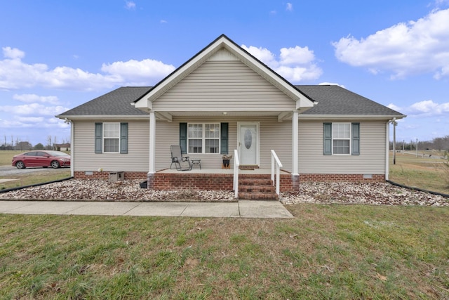 ranch-style home featuring a front lawn and a porch