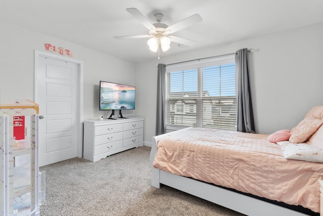 bedroom with light carpet and ceiling fan