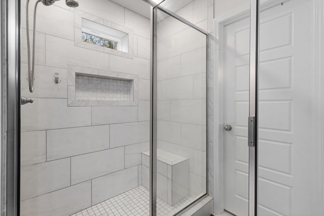 bathroom with a shower with shower door