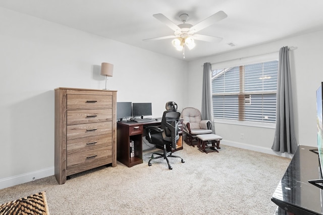 carpeted office with ceiling fan