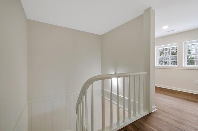 hall with wood-type flooring