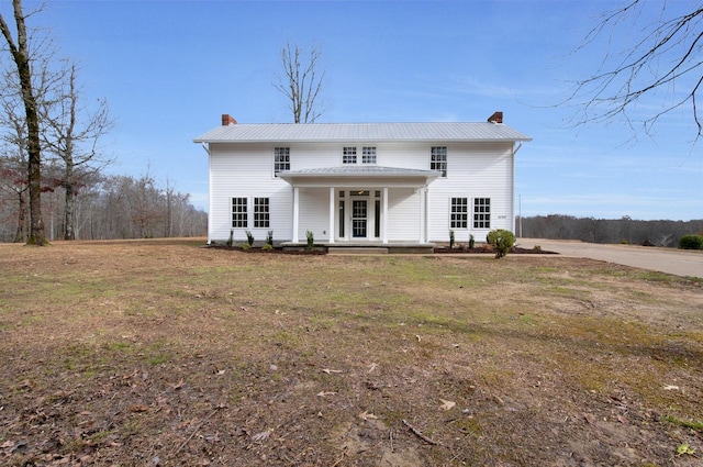 view of front of home featuring a front lawn and a porch