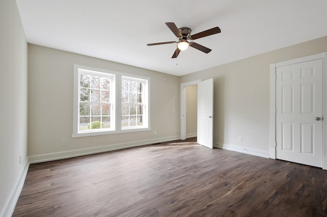 unfurnished bedroom with dark wood-type flooring and ceiling fan