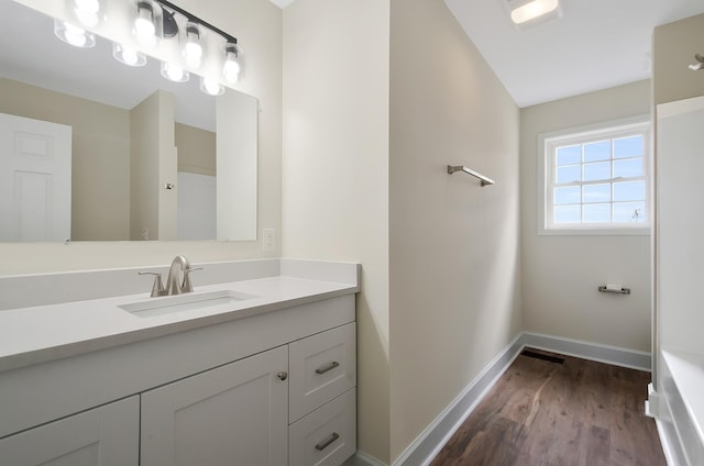 bathroom featuring vanity and hardwood / wood-style floors