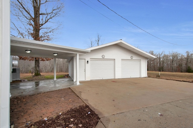 garage featuring a carport