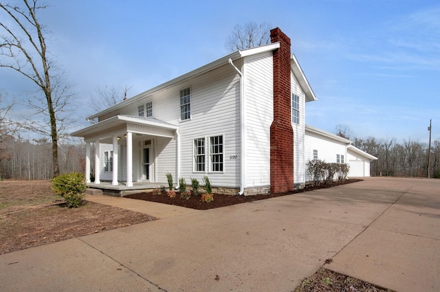 view of front facade with a garage and covered porch