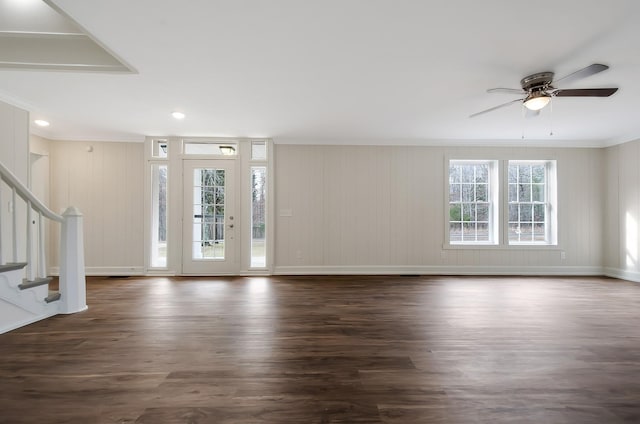 entryway featuring dark hardwood / wood-style flooring, ceiling fan, ornamental molding, and a healthy amount of sunlight