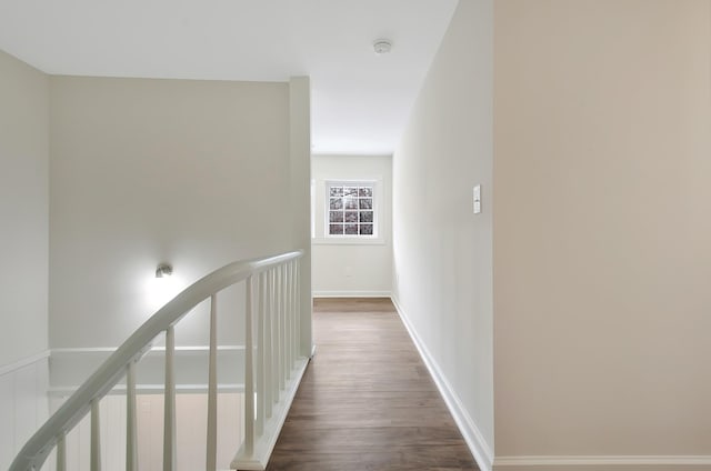 corridor featuring dark wood-type flooring