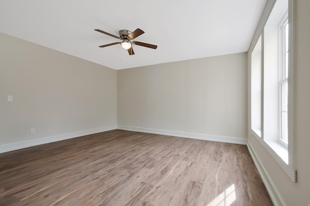 unfurnished room featuring light hardwood / wood-style floors and ceiling fan