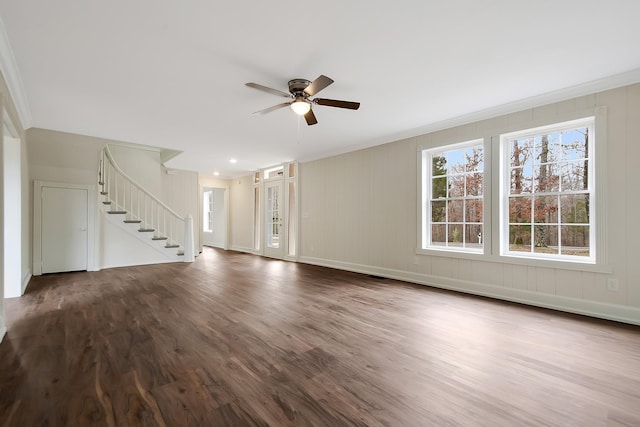 unfurnished living room featuring wood-type flooring, ornamental molding, and ceiling fan