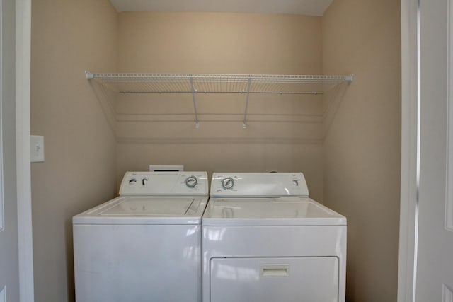 laundry area with washer and clothes dryer