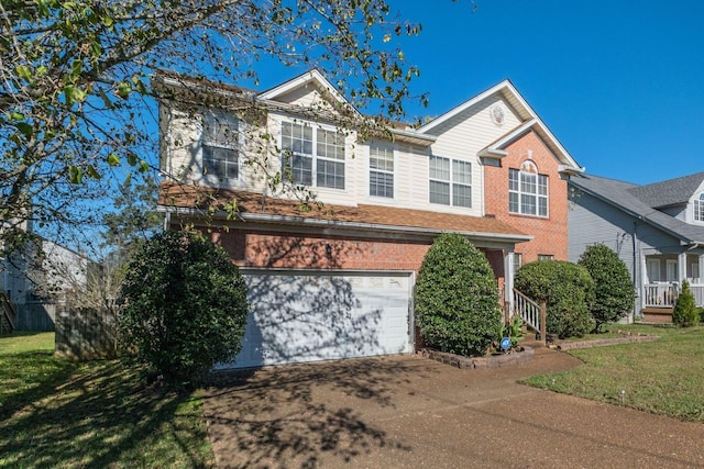 view of front of home featuring a garage and a front lawn