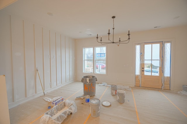 unfurnished dining area with a notable chandelier and a wealth of natural light