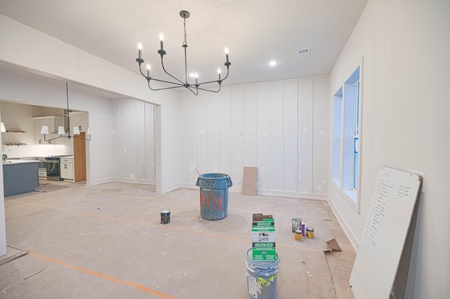 unfurnished dining area with visible vents and a notable chandelier