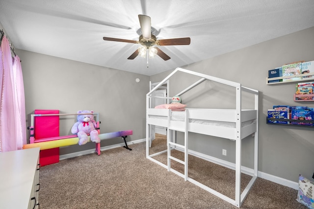 carpeted bedroom with a textured ceiling and ceiling fan