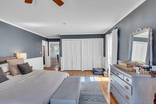 bedroom with crown molding, ceiling fan, and light hardwood / wood-style floors