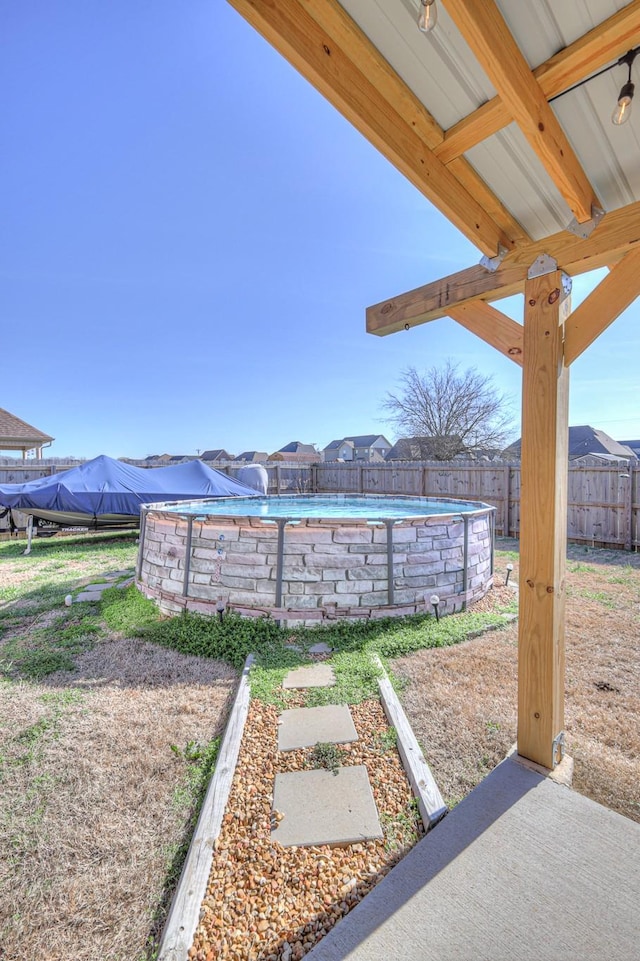 view of yard featuring a fenced in pool