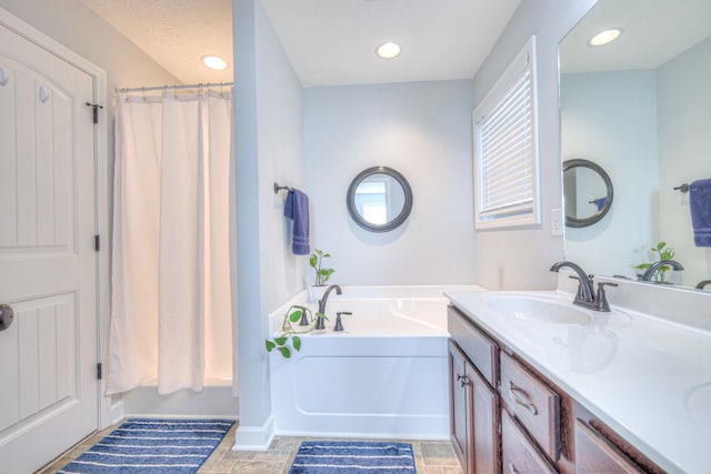 bathroom featuring a tub and vanity