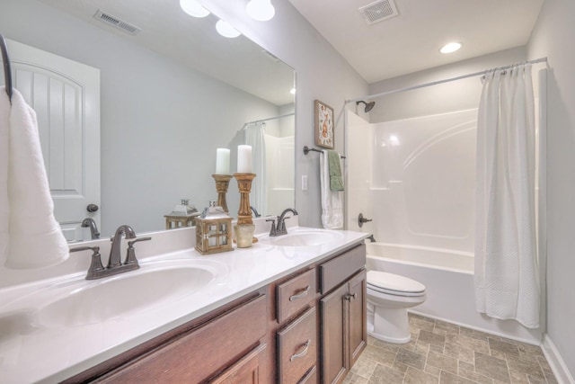 bathroom featuring visible vents, shower / tub combo with curtain, and a sink