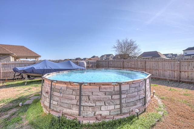 view of pool with a fenced backyard and a fenced in pool