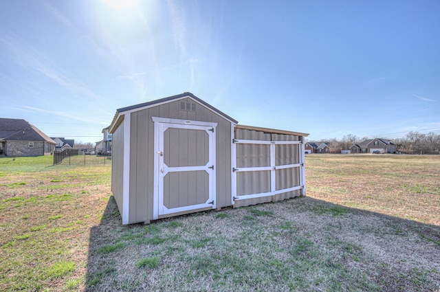 view of shed with fence