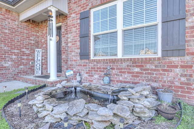 exterior space with brick siding