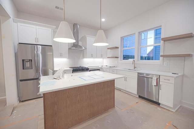 kitchen featuring open shelves, stainless steel appliances, a sink, visible vents, and wall chimney exhaust hood