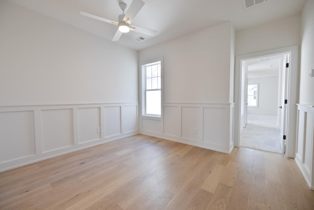 4044 Penfield Dr Unit C, Franklin, TN 37069 - spare room with a decorative wall, a wainscoted wall, light wood-style flooring, and a ceiling fan
