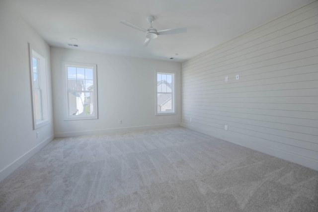4044 Penfield Dr Unit C, Franklin, TN 37069 - spare room featuring visible vents, ceiling fan, wooden walls, carpet floors, and baseboards