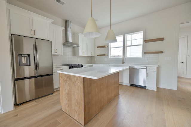 4044 Penfield Dr Unit C, Franklin, TN 37069 - kitchen featuring open shelves, backsplash, wall chimney range hood, appliances with stainless steel finishes, and a kitchen island