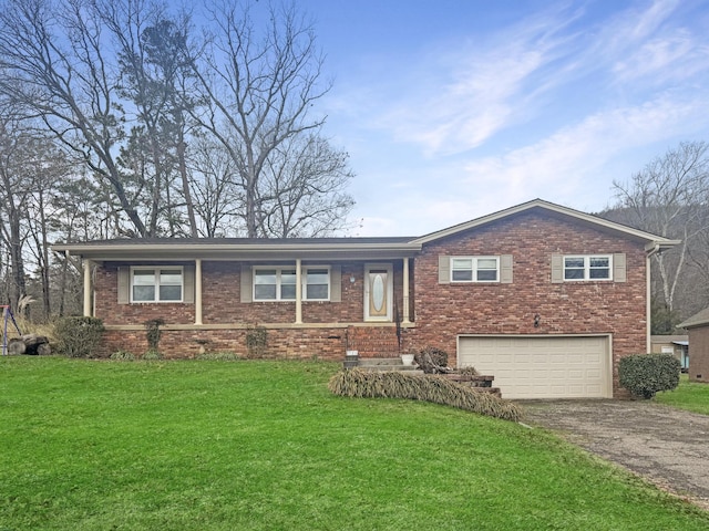 view of front facade with a garage and a front lawn