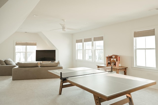 game room with lofted ceiling, carpet floors, a wealth of natural light, and ceiling fan