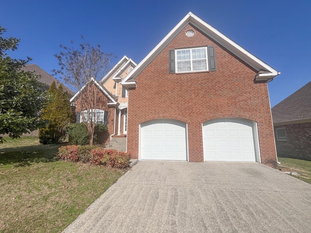 view of front property with a garage and a front lawn