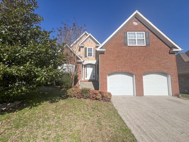 view of front of house with a garage and a front lawn