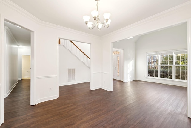 interior space featuring ornamental molding, dark hardwood / wood-style floors, and an inviting chandelier