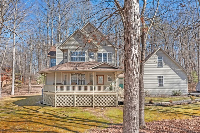 view of front of house with a front lawn and a porch