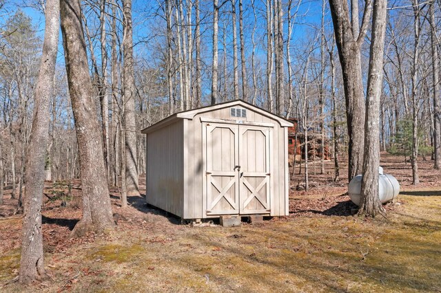 view of outbuilding featuring a yard