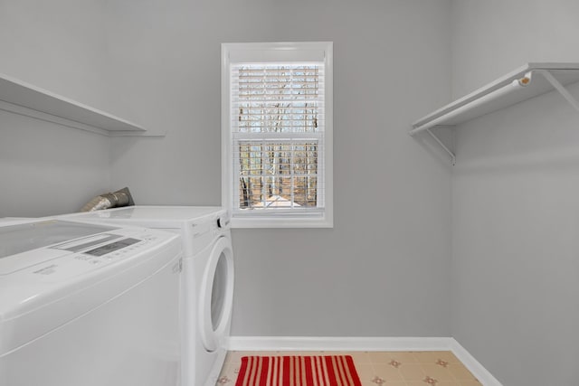 clothes washing area with washer and dryer