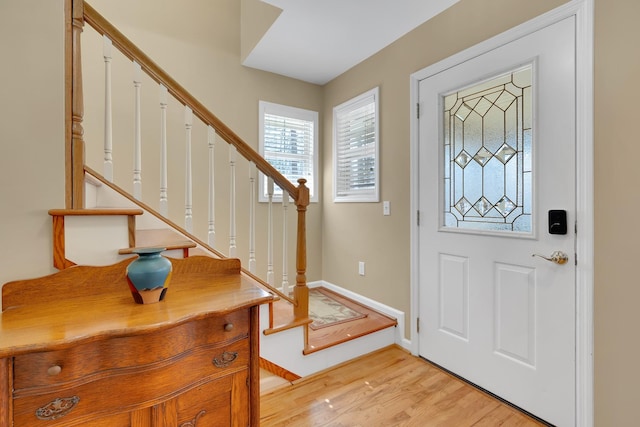 foyer entrance with light wood-type flooring