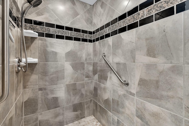 bathroom with tiled shower