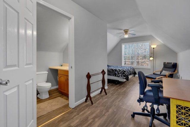 office featuring ceiling fan, lofted ceiling, and dark hardwood / wood-style flooring