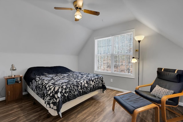 bedroom featuring ceiling fan, vaulted ceiling, and dark hardwood / wood-style flooring