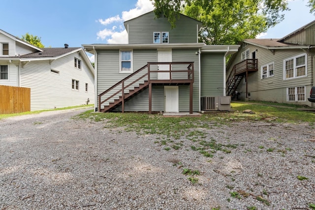 rear view of house featuring a deck and central air condition unit