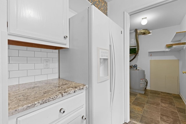 474 S Main St Unit 203, Ashland City, TN 37015 - kitchen with water heater, white cabinetry, backsplash, white fridge with ice dispenser, and light stone countertops