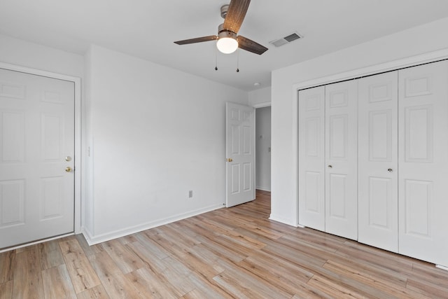 474 S Main St Unit 203, Ashland City, TN 37015 - unfurnished bedroom with ceiling fan, a closet, and light hardwood / wood-style flooring