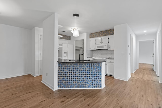474 S Main St Unit 203, Ashland City, TN 37015 - kitchen featuring sink, white appliances, white cabinetry, light hardwood / wood-style floors, and decorative backsplash