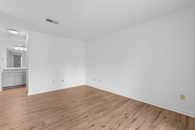 474 S Main St Unit 203, Ashland City, TN 37015 - spare room featuring light wood-type flooring